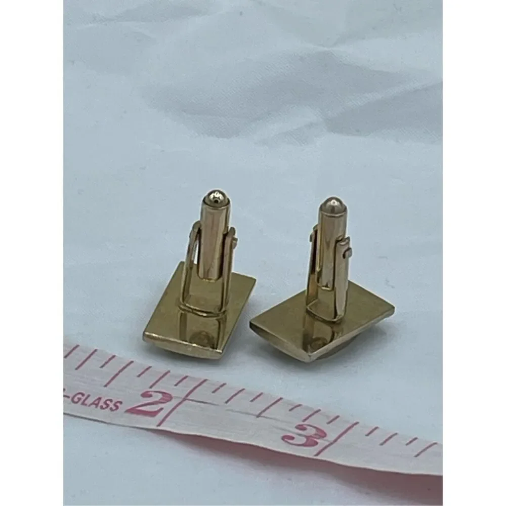 Vintage gold tone cufflinks with cut red glass crystals